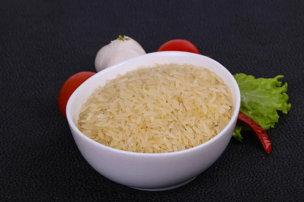 Raw uncooked rice in the bowl — Stock Photo, Image