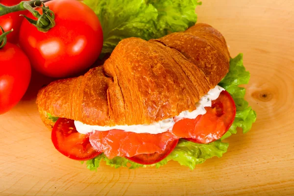 Croissant with salmon — Stock Photo, Image