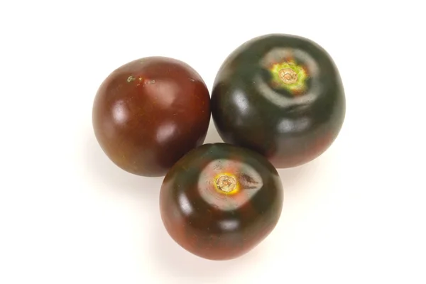 Schwarze Tomate - leckere frische Kumato — Stockfoto