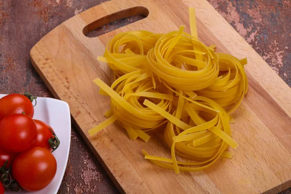 Fettuccini di pasta cruda — Foto Stock