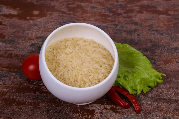 Raw uncooked rice in the bowl — Stock Photo, Image