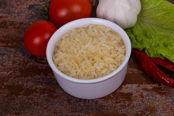 Raw uncooked rice in the bowl — Stock Photo, Image