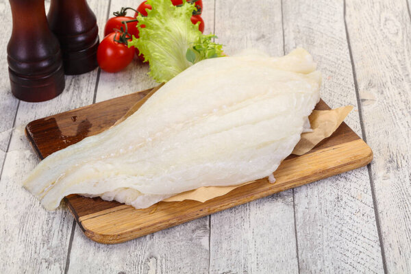 Raw halibut fillet ready for cooking