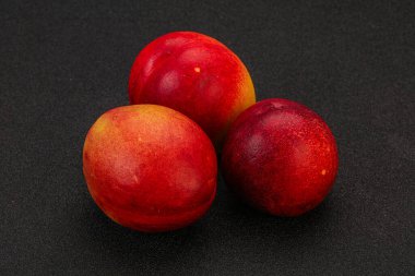 Tatlı olgun ve lezzetli Nectarine arka planda