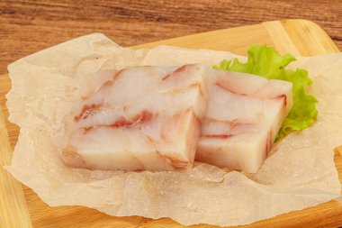 Raw dietary pollock fish fillet for cooking clipart