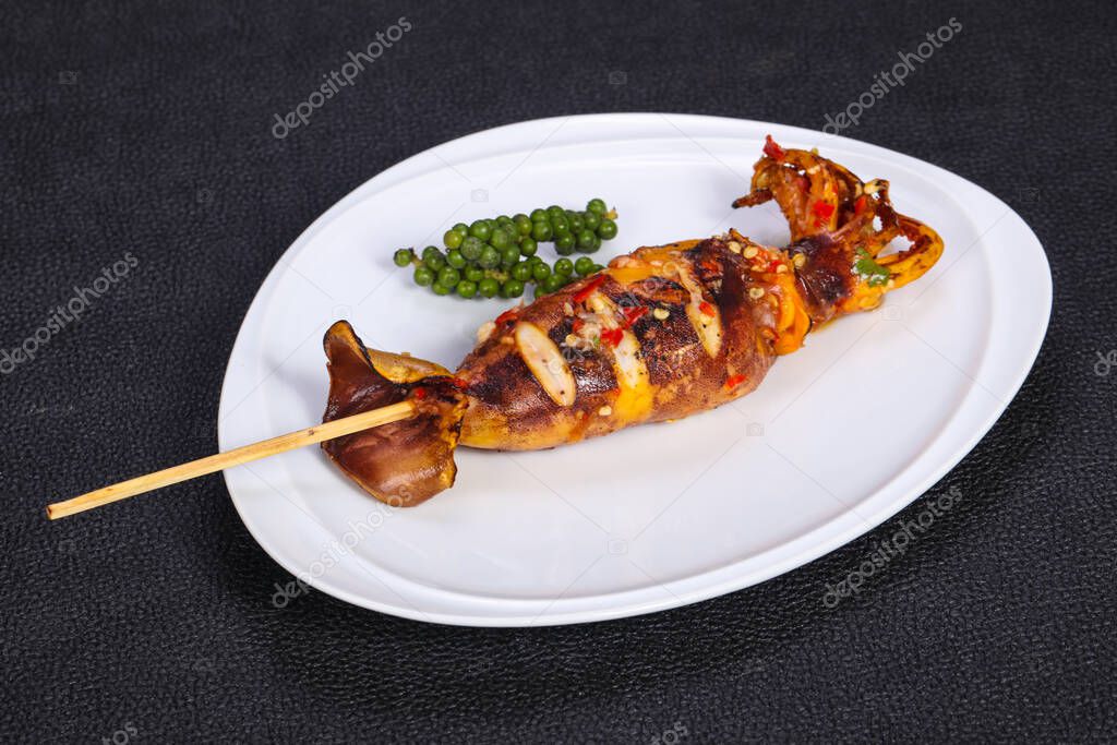 Grilled squid skewer with sauce and hebs