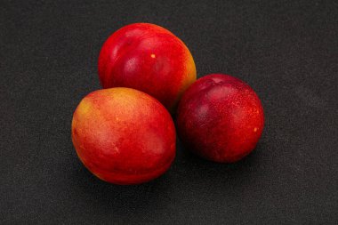 Tatlı olgun ve lezzetli Nectarine arka planda