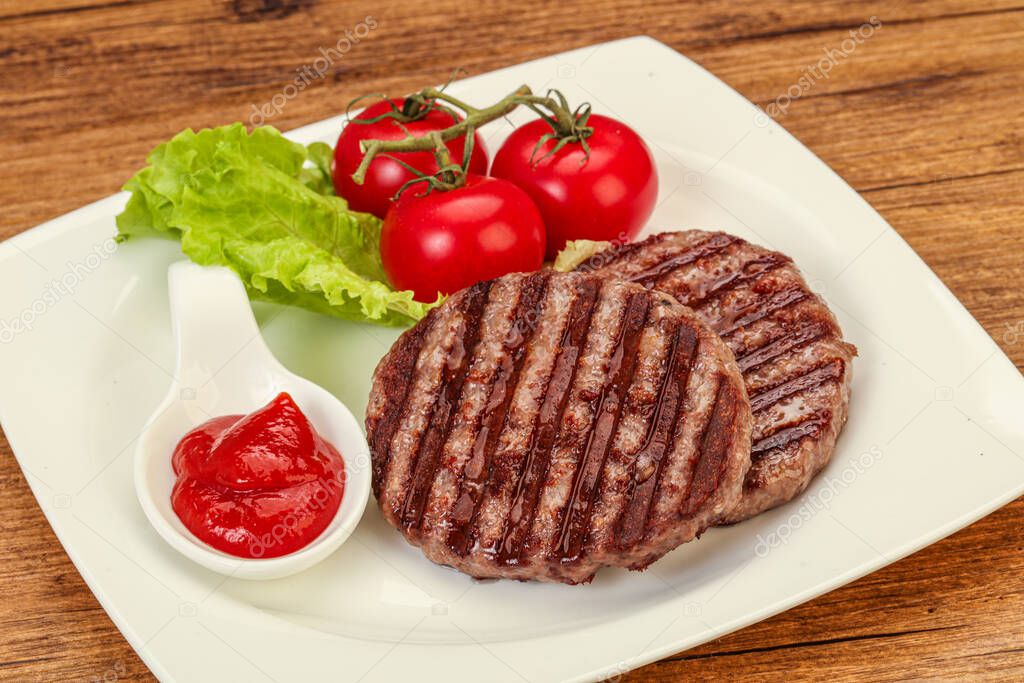 Grilled burger cutlet with tomato sauce