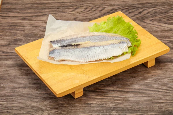 Herring fillet with salad leaves over board — Stock Image Herring Fillet Salad Leaves Board Royalty Free Stock Images