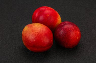 Tatlı olgun ve lezzetli Nectarine arka planda