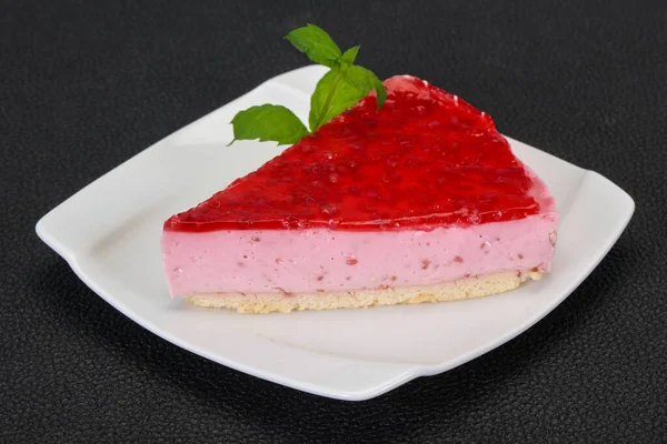 Soft Raspberry cheesecake served mint in the plate