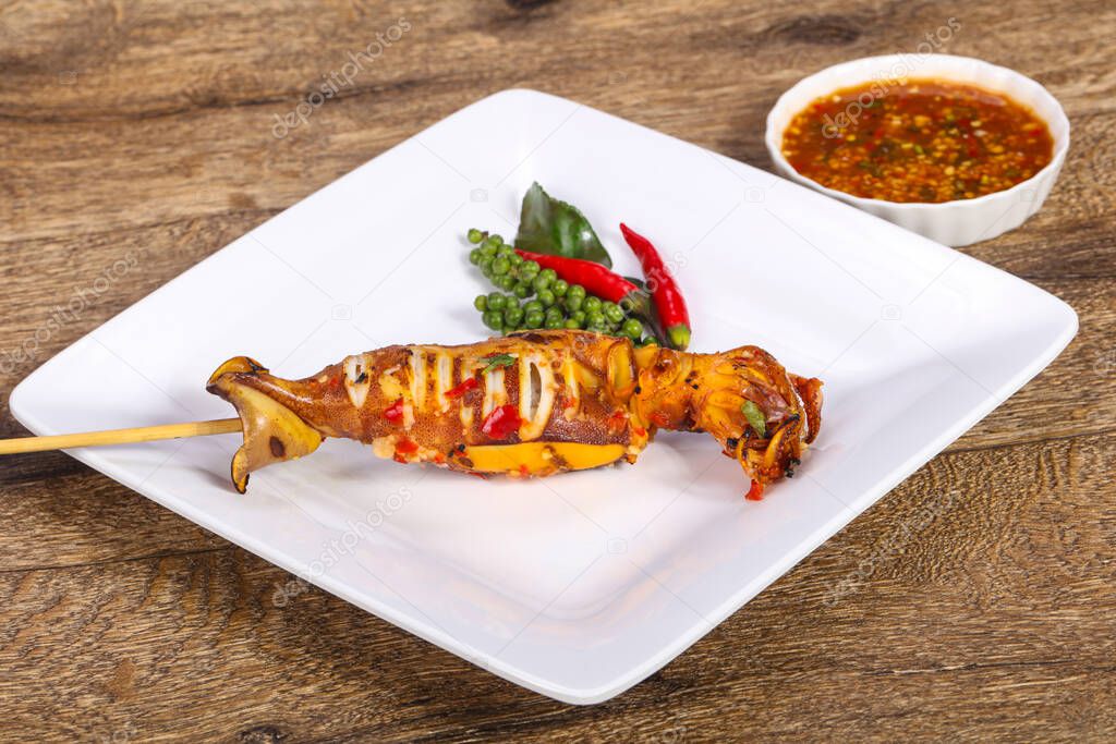 Grilled squid skewer with sauce and hebs