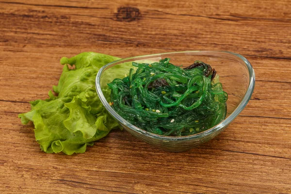 Green Chuka Seaweed Salad Isolated on White Background Top View. Wakame Sea Kelp Salat, Chukka Sea Weed, Healthy Algae Food