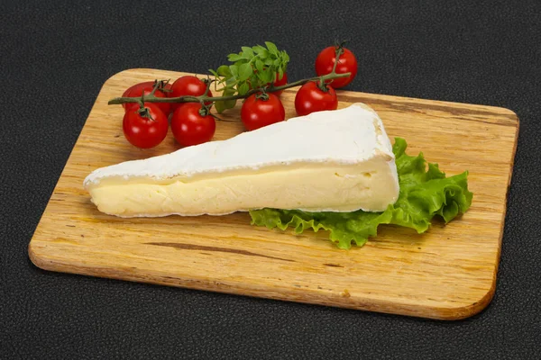 Brie cheese triangle served salad leaves