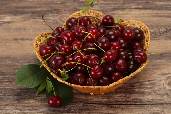 Sweet ripe cherry heap with leaves