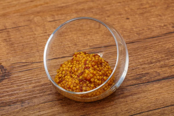 Dijon mustard sauce with seeds in the bowl