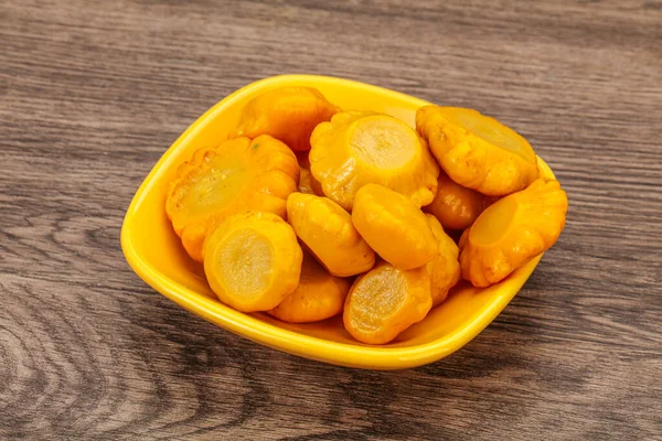 Vegetarian food - Marinated yellow patisson in the bowl