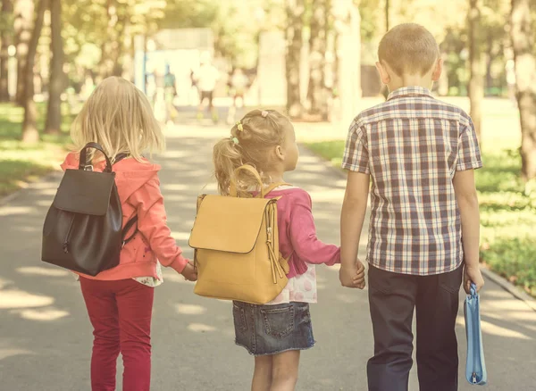 Little pupils walking home from school — Stock Photo, Image