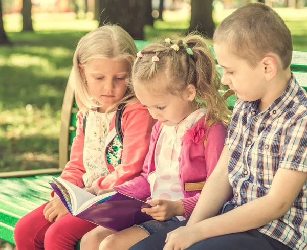 Little kids watching notes — Stock Photo, Image