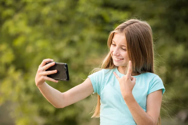 Teenage girl taking selfie Stock Image