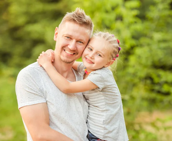 Dad holding little daughter — Stock Photo, Image