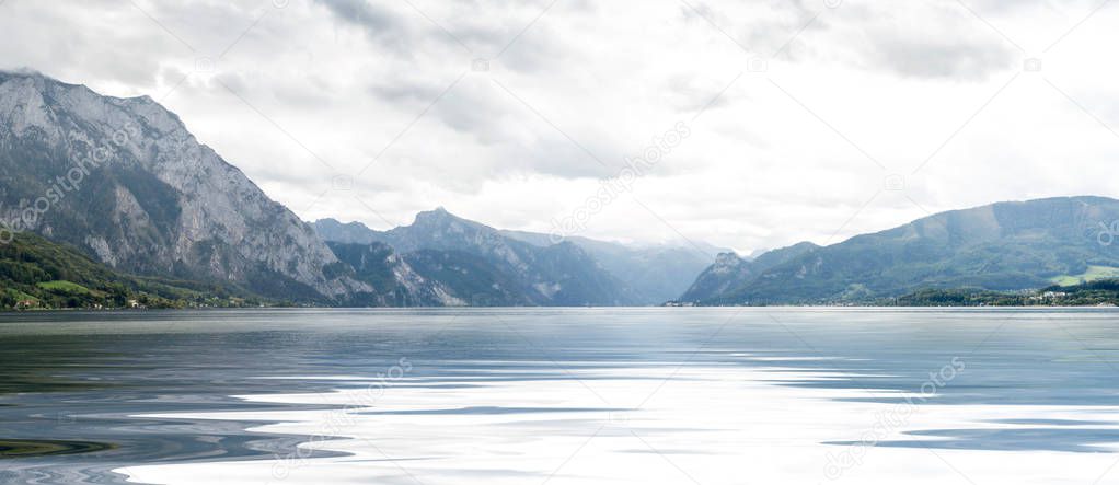 Panoramic view of wide lake and mountains around