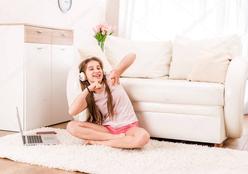 Girl listening to music in the living room