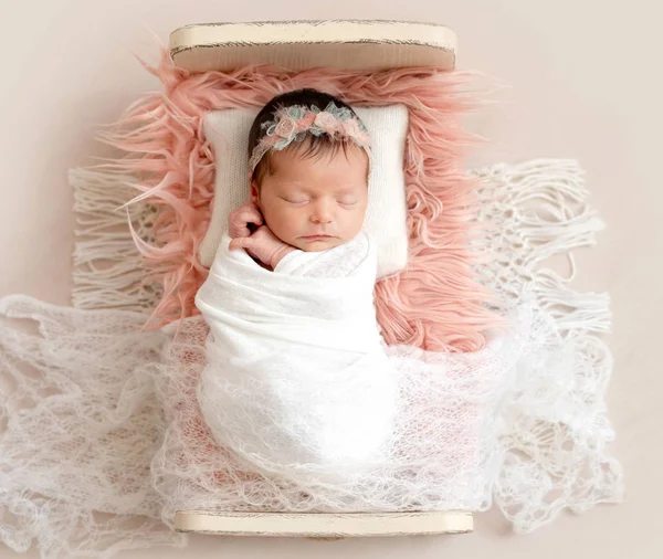 Newborn sleeping on baby bed — Stock Photo, Image