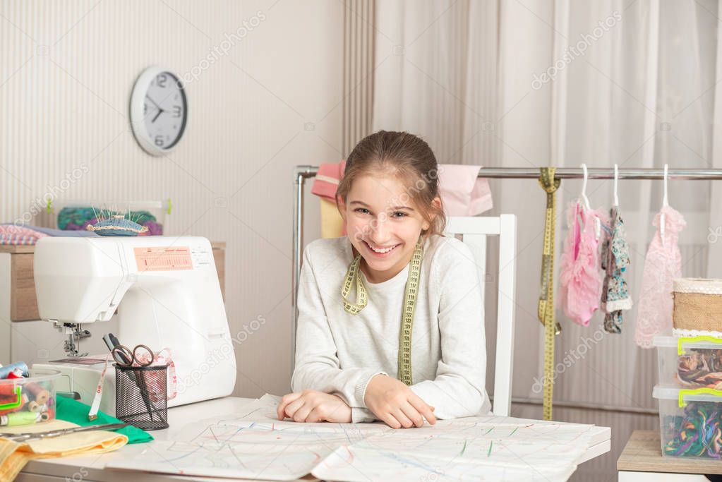 little girl in a sewing workshop