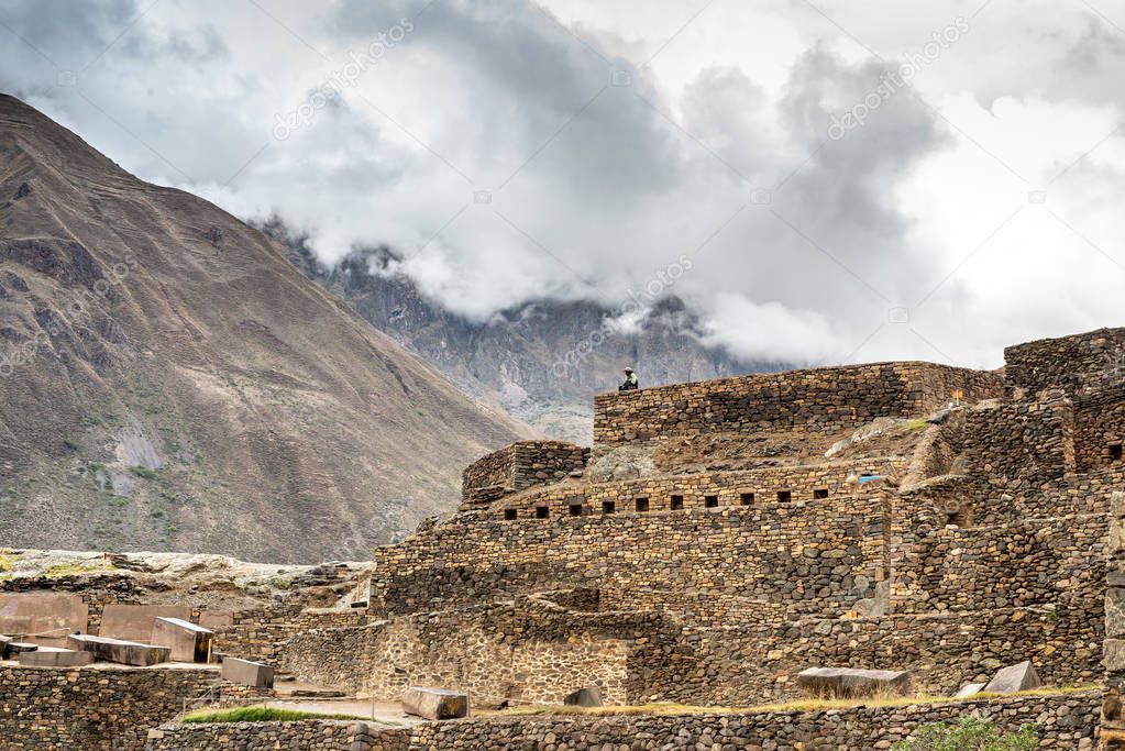 Old Incan castle from stone on mountain background