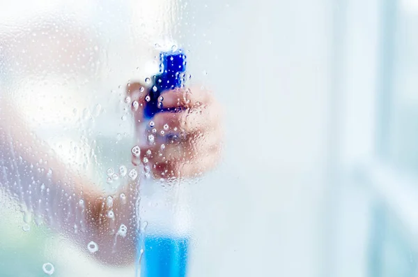 Female person holding spray — Stock Photo, Image