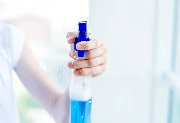 Female person holding spray — Stock Photo, Image