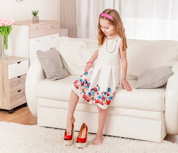 Child trying new heel shoes — Stock Photo, Image