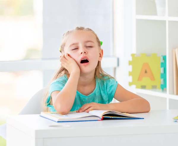 Cute dreaming little girl at school — Stock Photo, Image