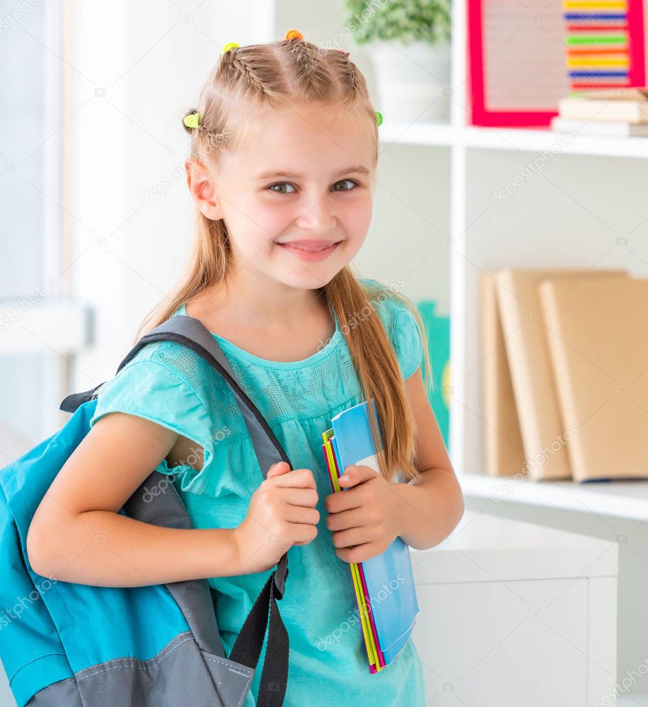 Smiling little girl ready back to school