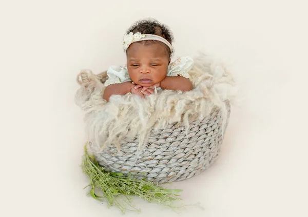 Baby girl in basket — Stock Photo, Image