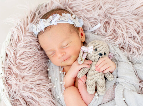 newborn baby sleeping in the basket