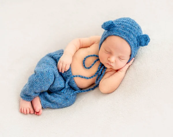 Cute boy in blue bonnet sleeping — Stock Photo, Image