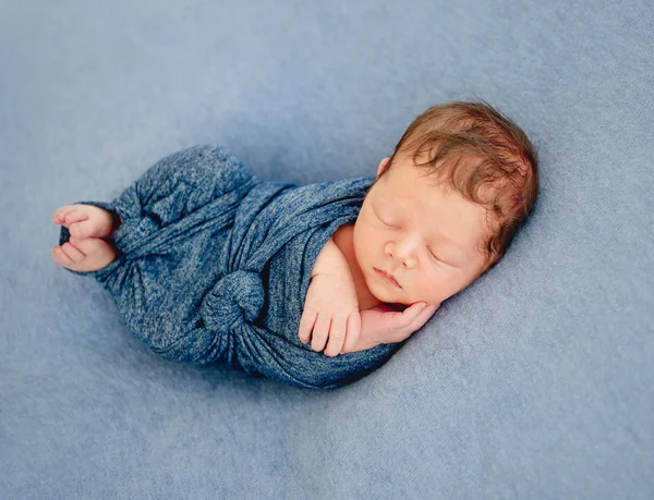 Newborn boy wrapped in a blanket — Stock Photo, Image