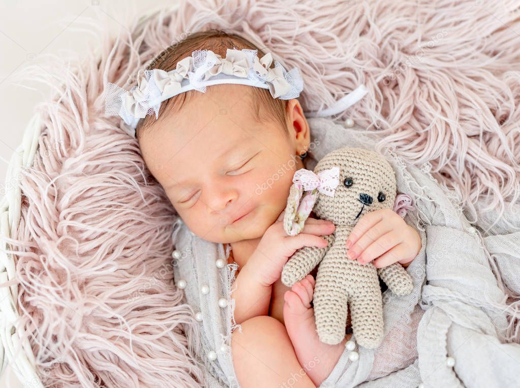 newborn baby sleeping in the basket