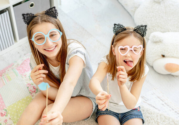 Beautiful girls having fun in playroom