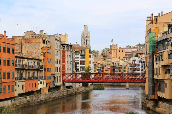 Colorful houses and Eiffel bridge on river Onyar in Girona