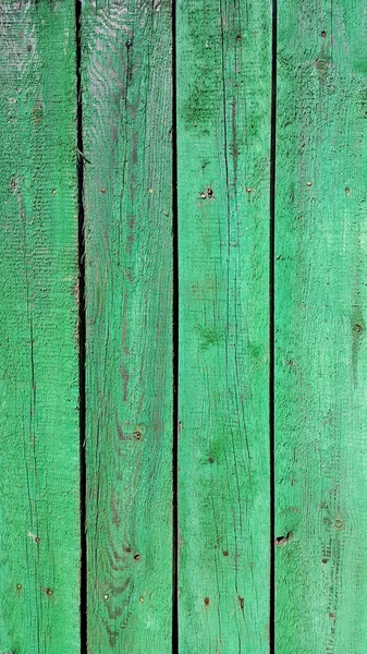 Textuur van verweerde houten groen geschilderde hek — Stockfoto