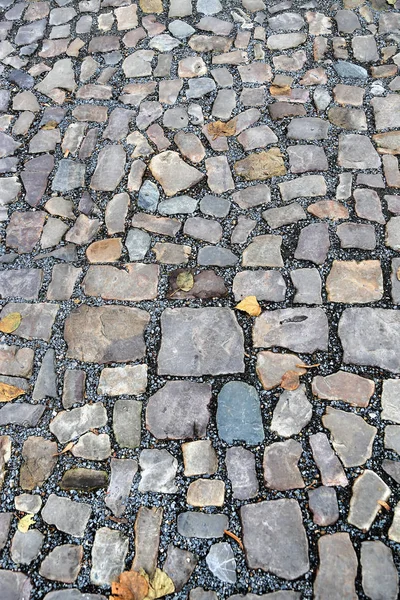 Paving stones road with gravel — Stock Photo, Image