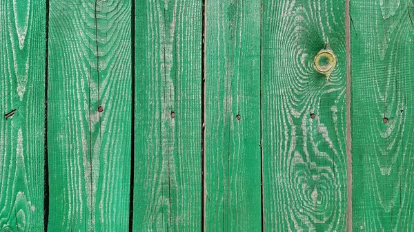 Konsistens av vittrade trä grön målade staket — Stockfoto