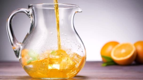 Pitcher of orange lemonade — Stock Video