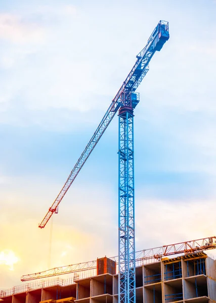 Construction cranes on blue sky background — Stock Photo, Image