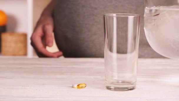 Pregnant woman taking her pills — Stock Video