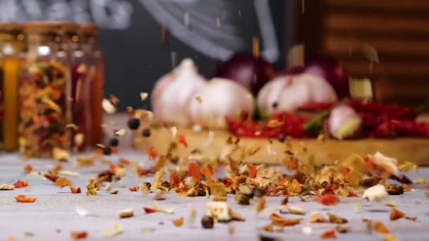 Mix of spices spilling on table — Stock Video