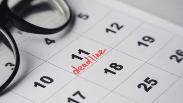 Crop person encircling deadline date in calendar — Stock Video